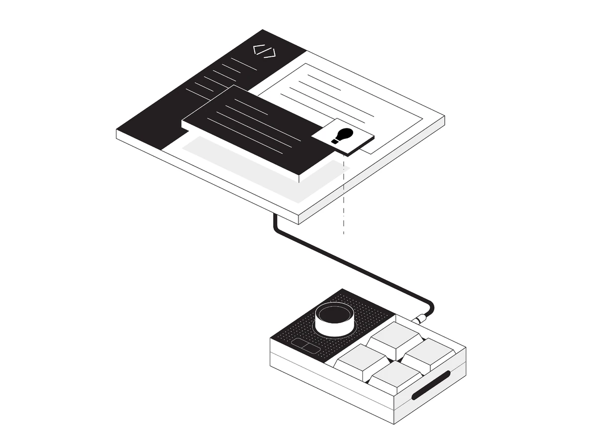 Isometric code editor with a light bulb card, wired to a macro pad with a dial and four keys.
